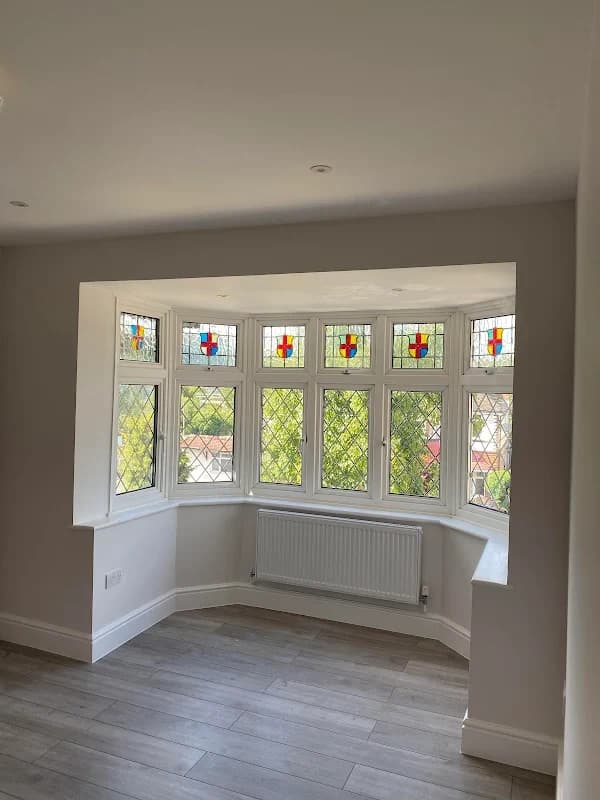 Bright loft conversion with Velux skylights and white finish by Albert Construction in London