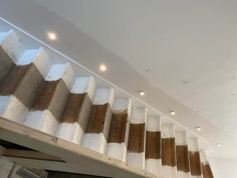 Modern glass balustrade staircase installed by Albert Construction